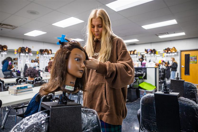 Centennial High students in the cosmetology class